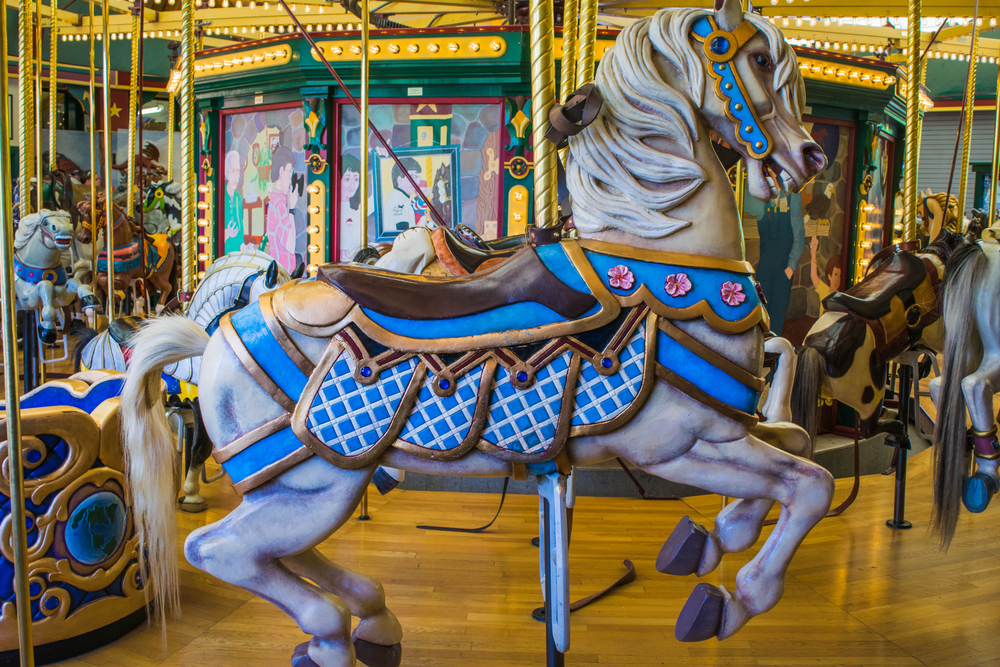 A white, carved horse on the Carousel for Missoula, one of the best things to do in Missoula, Montana.
