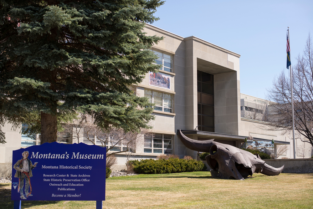 Exterior of Montana's Museum with a giant statue of a bull skull.