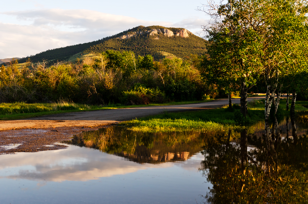 Mount Helena standing over a pond at golden hour.