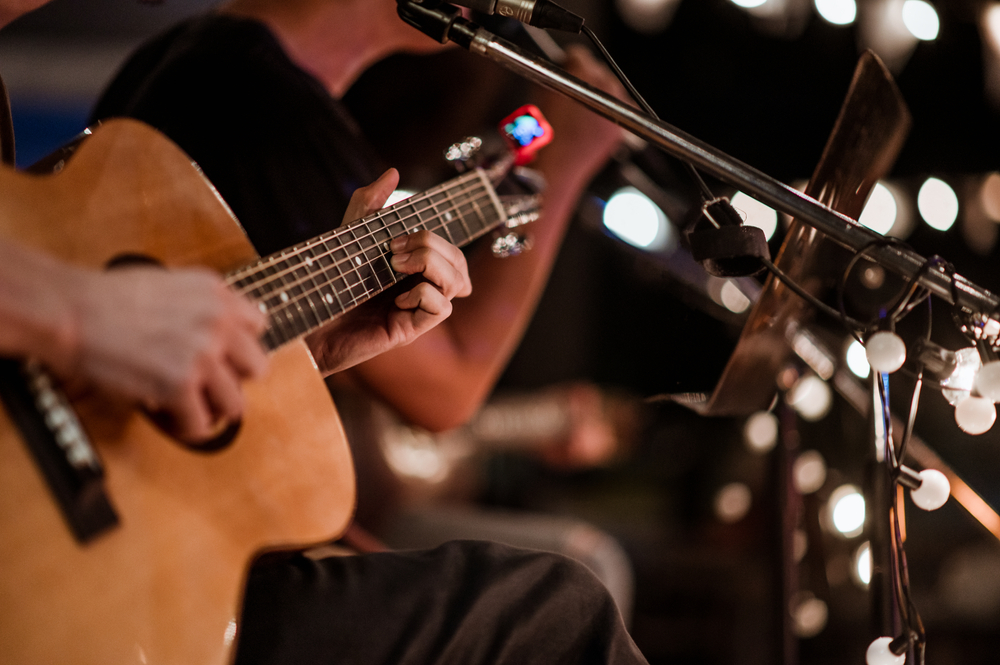 Close-up of guitarist performing.