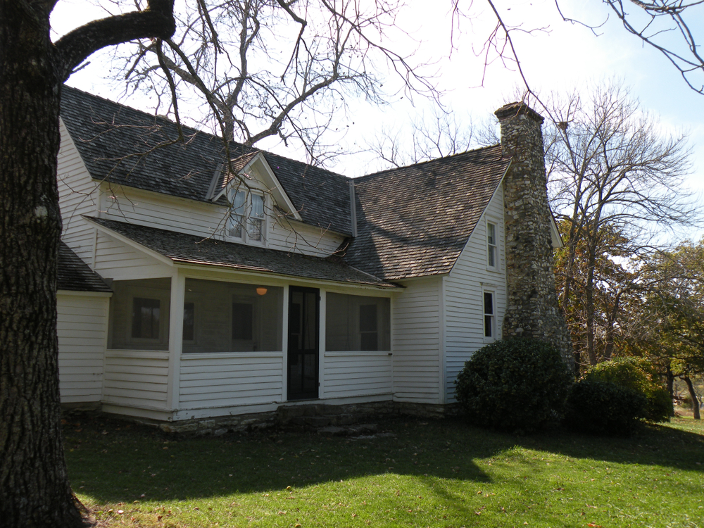 The white, wooden Laura Ingalls Wilder Home.