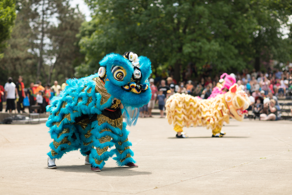 Members of the Tay Phuong Monastery perform a lion dance at the Asian Festival.