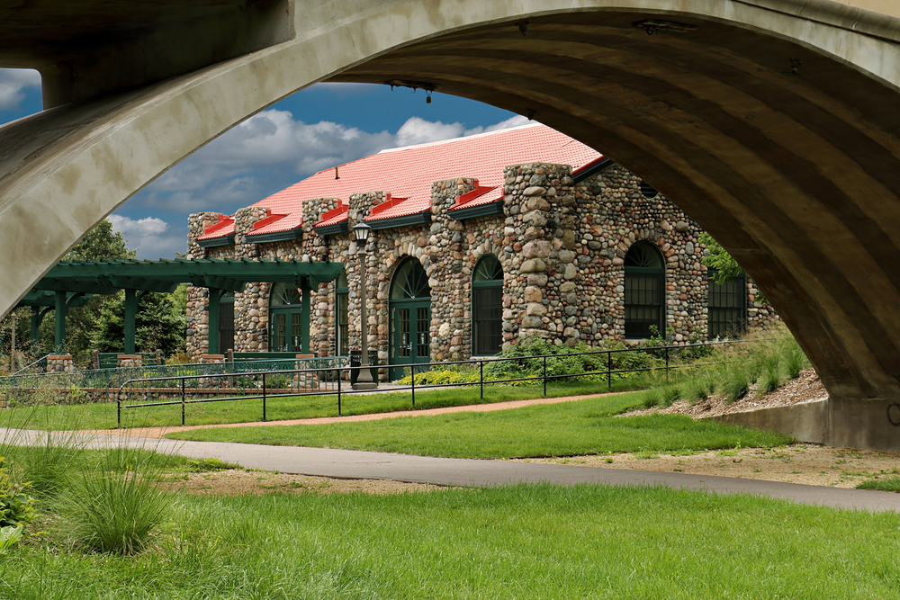 A historic stone building in a park