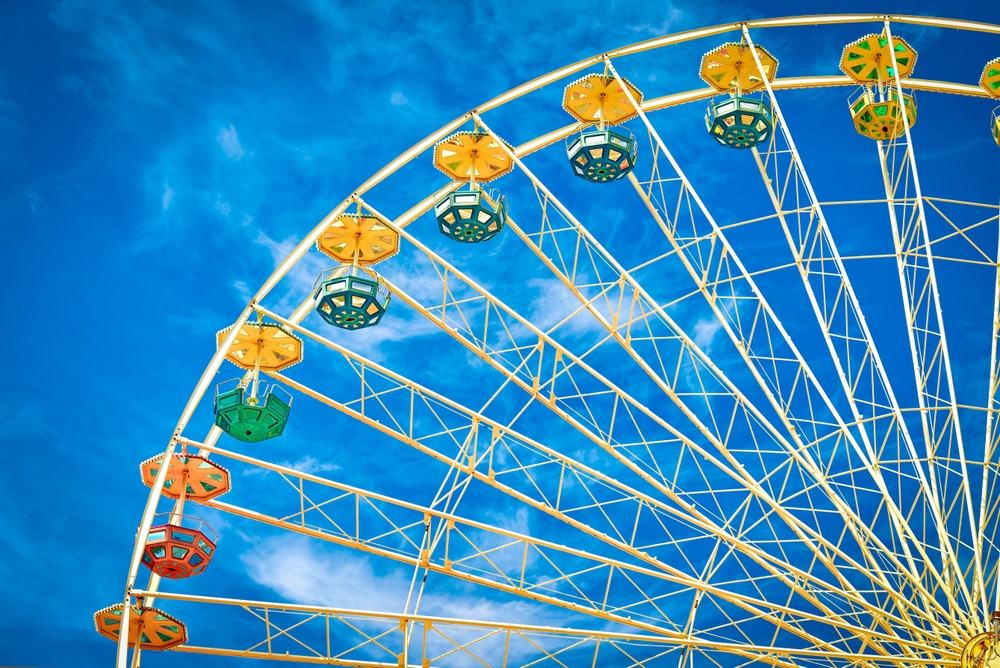 A close up image of a huge ferris wheel on a sunny day one of the best things to do in St. Paul