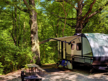 Camping trailer at a campsite in Starved Rock State Park, offering the best camping in the Midwest.