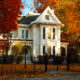 Fall leaves surrounding the pretty white Truman Home, one of the best things to do in Independence, MO
