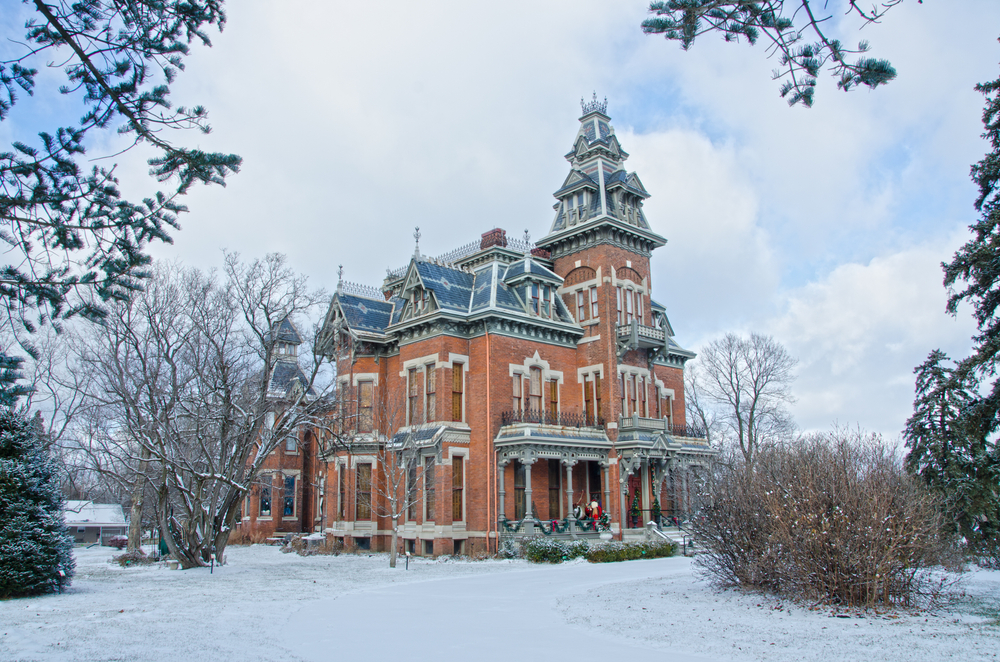Regal brick Vaile Mansion on a snowy day.
