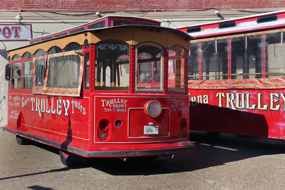 Two red trolley cars parked in downtown Galena IL