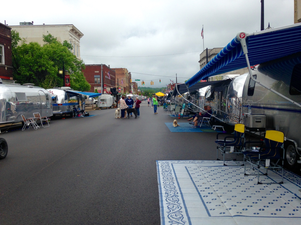 Airstream recreational vehicles are seen parked along the streets of Logan, Ohio . The article is about things to do in Logan Ohio. 