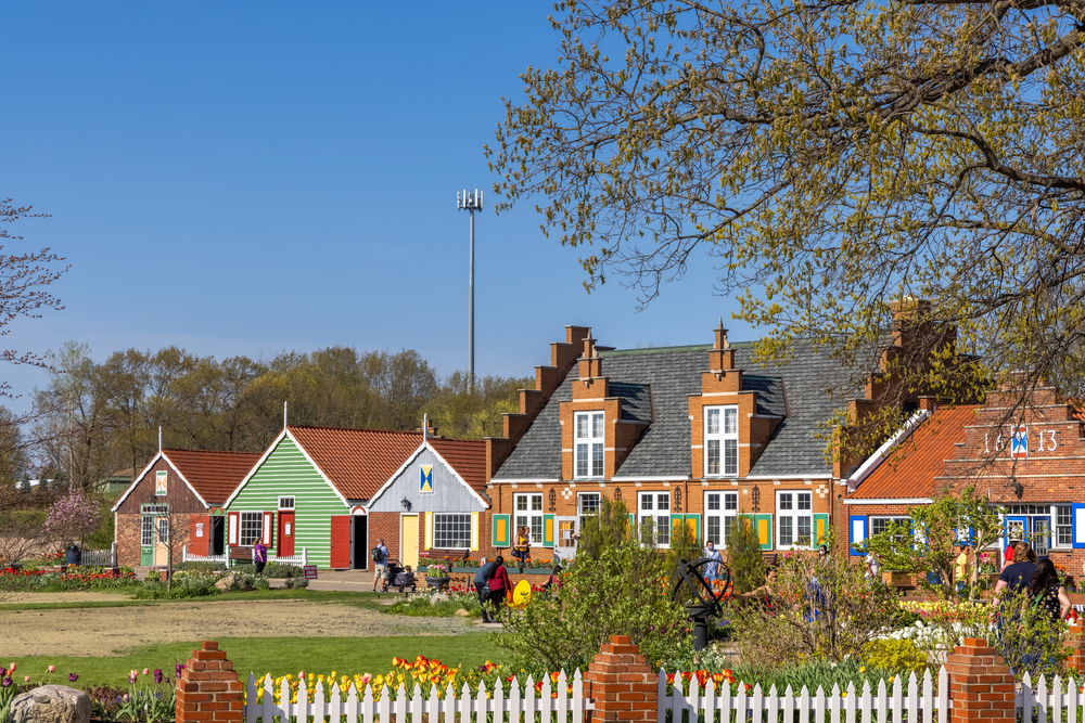 Colorful Dutch-styled buildings and tulips at Windmill Island Gardens, one of the best things to do in Holland, MI.