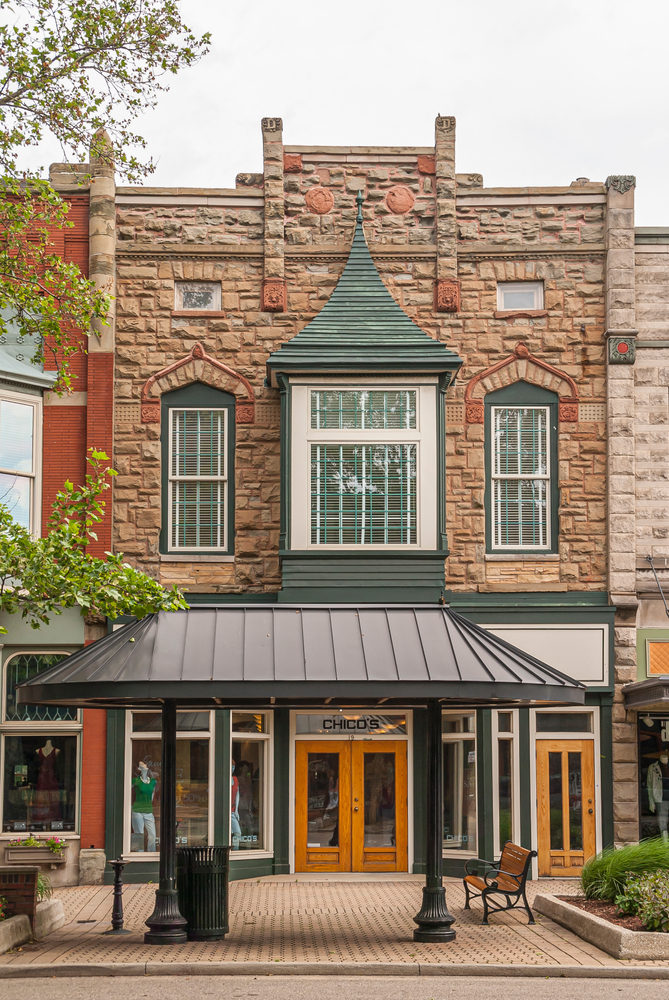 Stone facade of a historic building and shop in downtown Holland, MI.