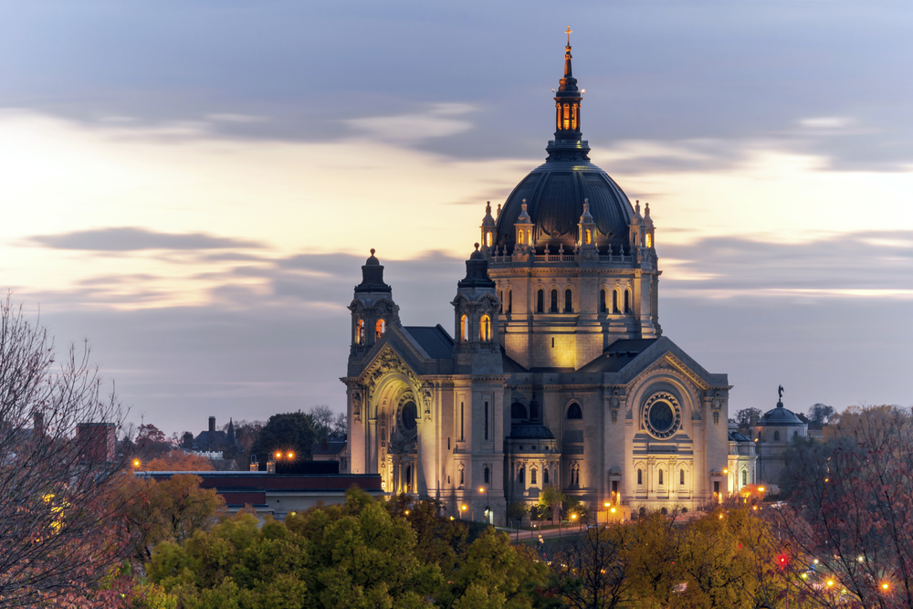 Dusk over the lit up, domed Cathedral of Saint Paul, one of the best attractions in Minnesota.