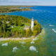 Aerial view of Cana Island Lighthouse on Lake Michigan, one of the best Door County attractions.
