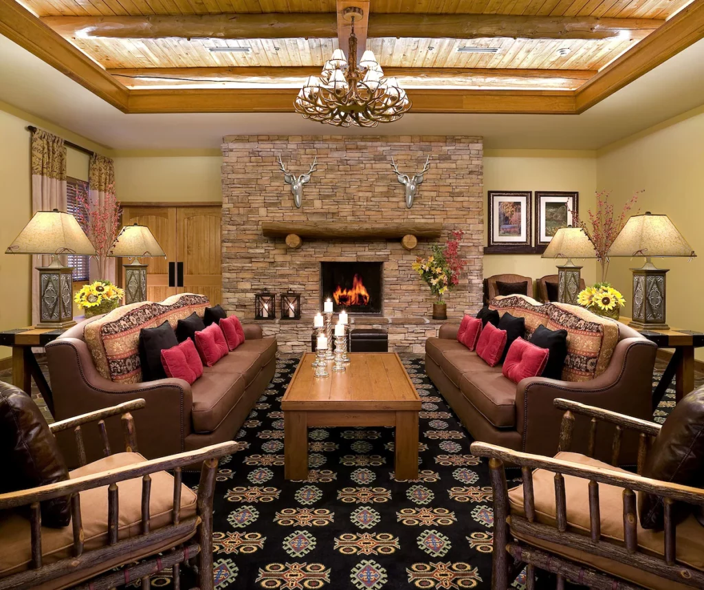 living room with a fireplace and sofas along with chairs branson family resorts