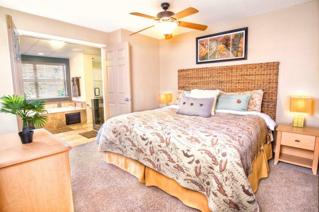 inside of a room with pillows and wooden furnishings with an attached bathroom branson family resorts