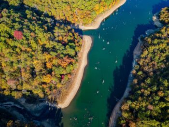 aerial view of a river with trees on both sides things to do at lake of the ozarks