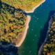 aerial view of a river with trees on both sides things to do at lake of the ozarks