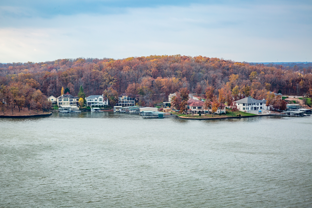 Lake of The Ozarks Missouri in fall colors with houses around the lake 