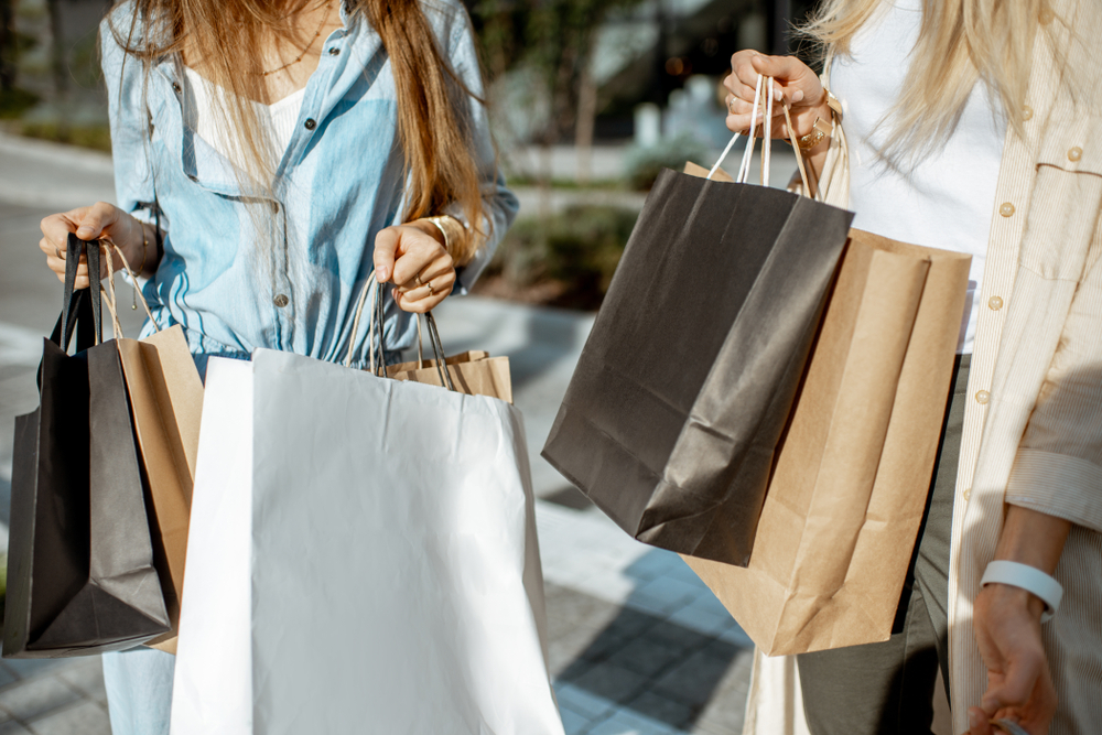 One of the things to do in Osage Beach MO is go shopping. this picture shows women with any shopping bags. 