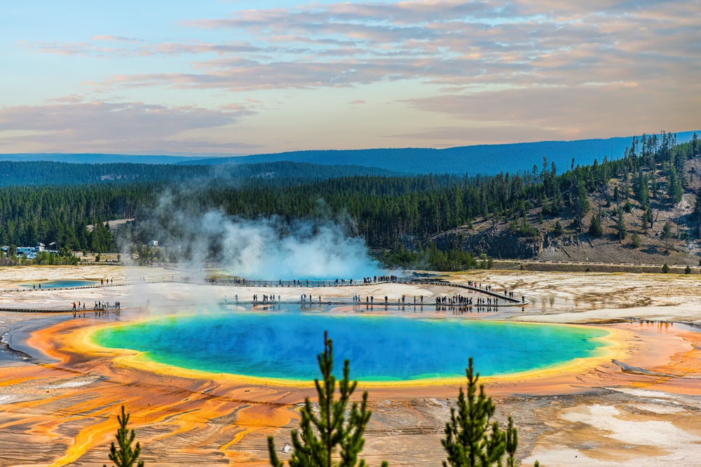 colorful spring surrounded by trees and mountains places to visit in the US before you die