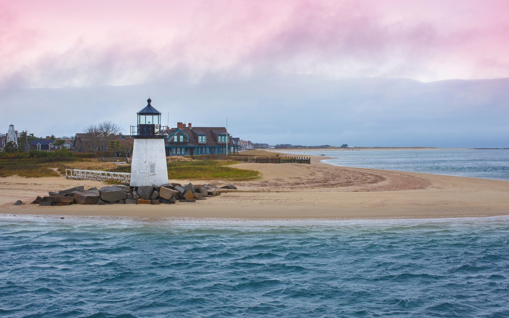 Seascape with Brant Point Lighthouse and dramatic pink clouds cape at twilight in Nantucket Massachusetts