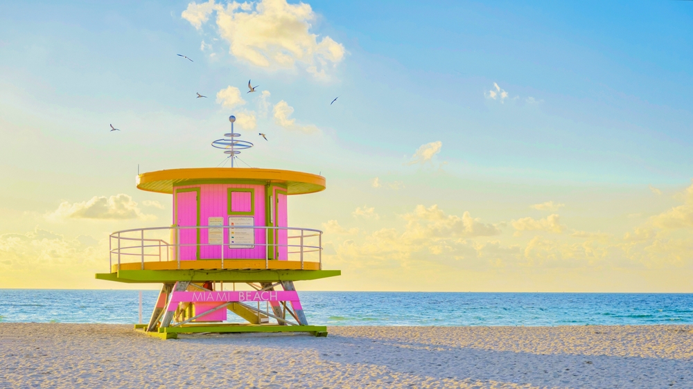 Lifeguard hut on the beach in Miami Florida, colorful hut on the beach during sunrise Miami South Beach. Sunny day on the beach. Beaches to Visit in the US Before You Die