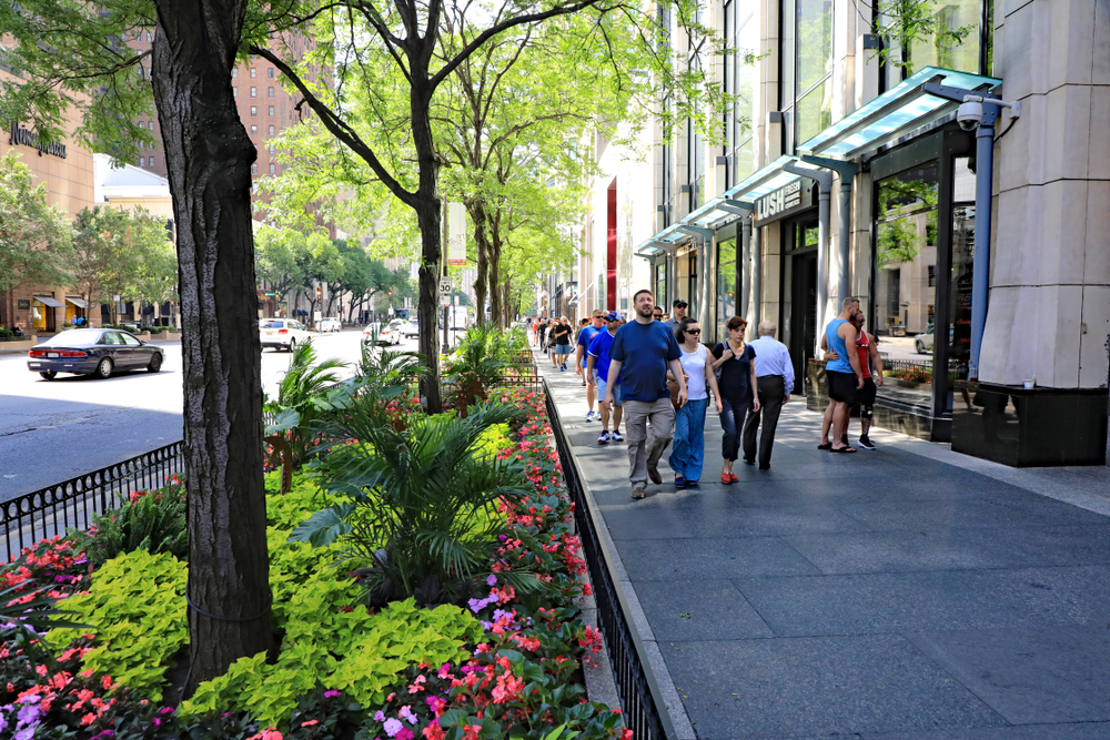 People shopping on Michigan Avenue in downtown Chicago on a pretty summer day.