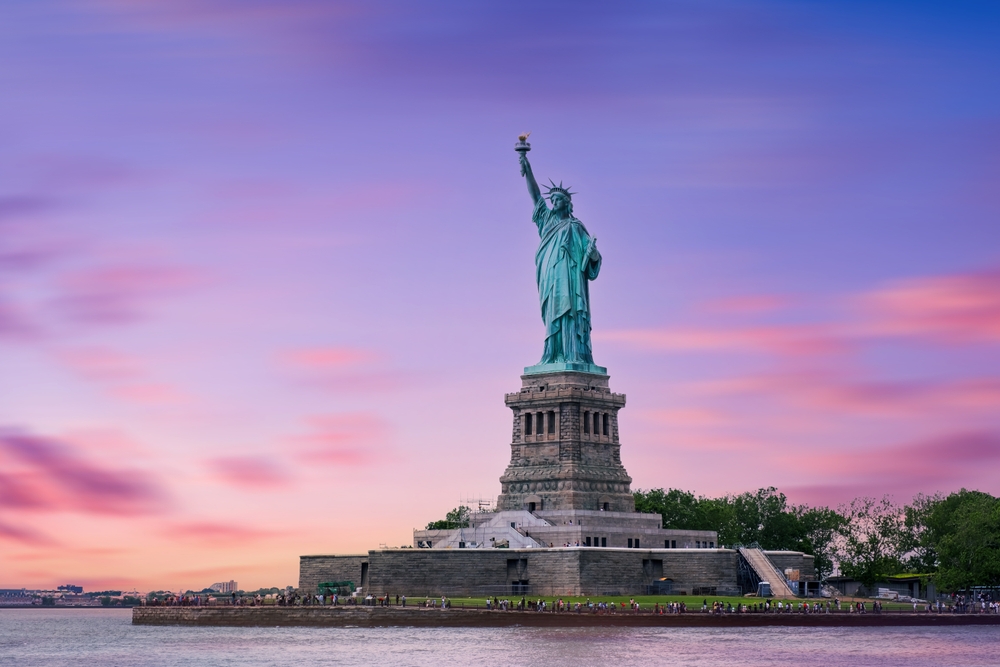 statue of liberty during sunset fly from cleveland