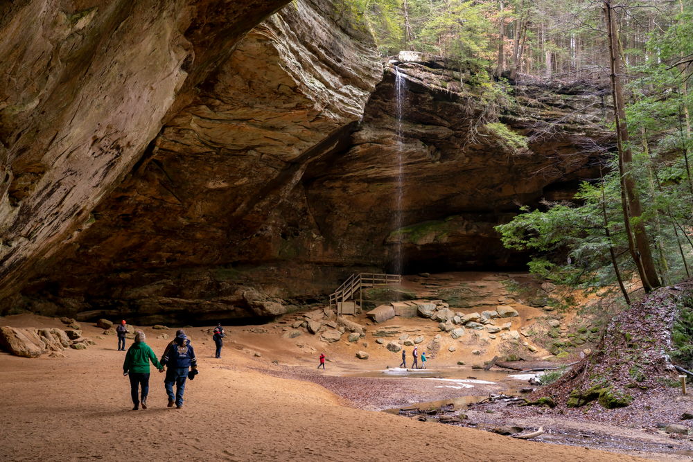 Tourists visit Ash Cave in Southeast Ohio at Hocking Hills State Park.