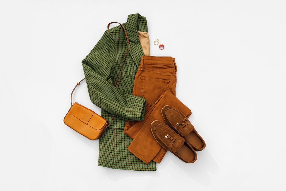 Jacket with pants and loafers on white background. Article is about Montana fall outfits.
