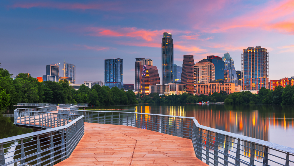 boardwalk with view of the city and sunset in the evening