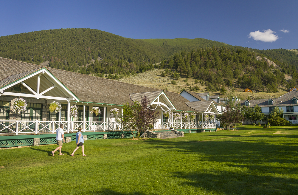 Chico Hot Springs resort with one of the building with flowers outside.