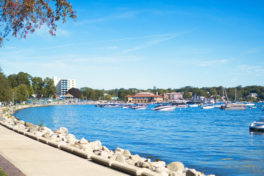 Lakeside of Lake Geneva in Wisconsin showing boats in the harbor.  