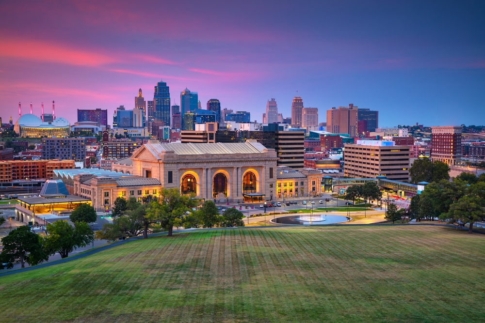  Aerial cityscape image of Kansas City skyline at twilight blue hour.