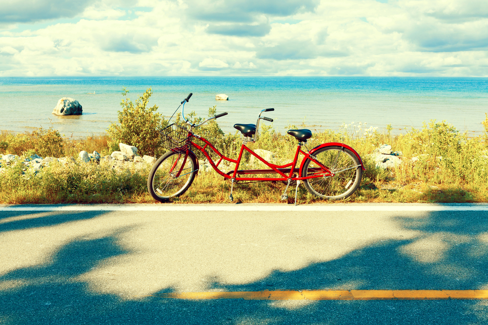 Red Tandem by a Lake in the Midwest.  The article is about spring break in the Midwest.