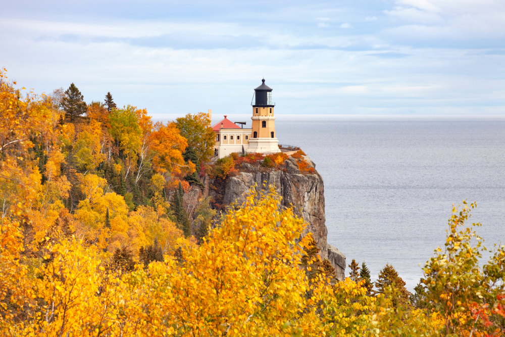Split Rock lighthouse on the north shore of Lake Superior in Minnesota during autumn. Article is about  North Shore Minnesota. 