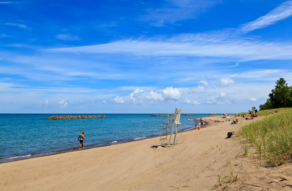 people relaxing on a beach with grass cleveland to buffalo