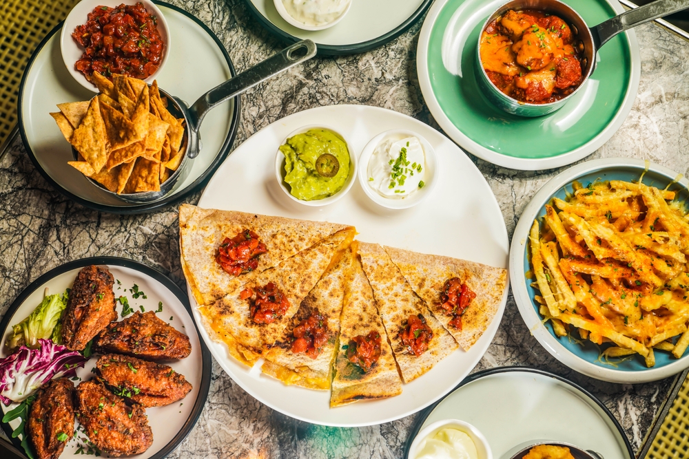 table serving mexican food and fries