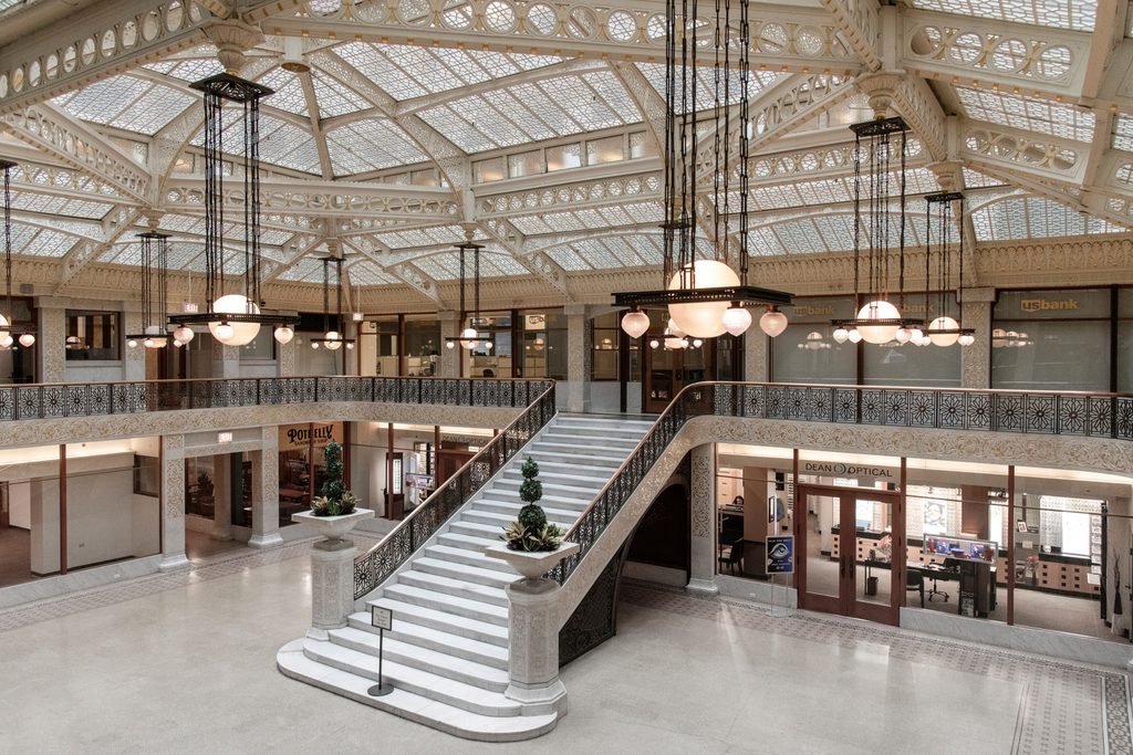 Interior of historic office Rookery Building at South LaSalle Street the oldest standing high-rise in Chicago with lobby was remodeled by Frank Lloyd Wright. you can see the glass ceiling and the large staircase. 